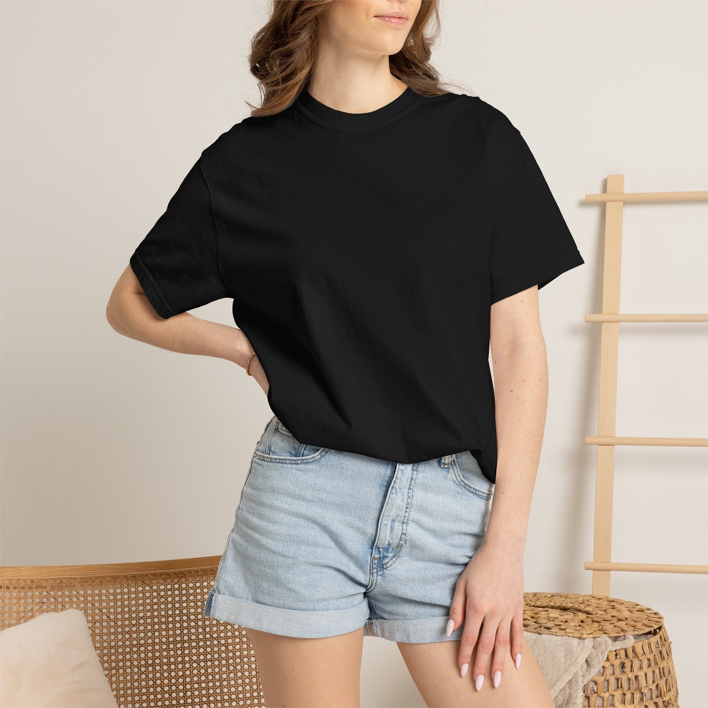 Woman wearing the black heavyweight WE ARE The Movement T-shirt