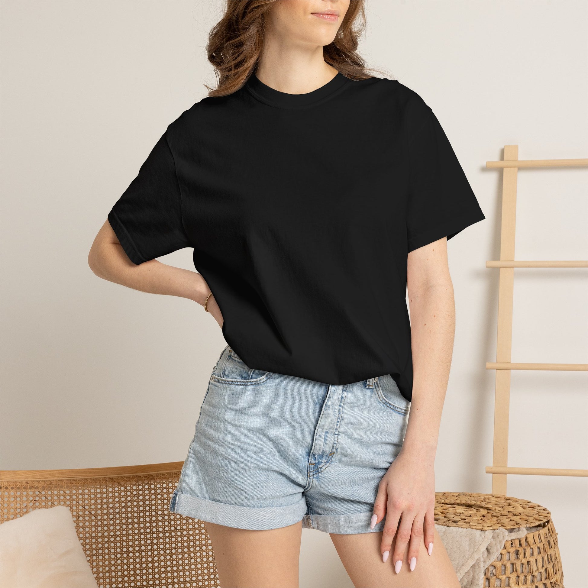 Woman wearing the black heavyweight WE ARE The Movement T-shirt